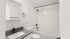 Modern bathroom featuring sleek fixtures, elegant white subway tiles, and a stylish vanity with a contemporary faucet.