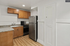 Modern kitchen featuring sleek stainless steel appliances, stylish wooden cabinetry, and elegant granite countertops.