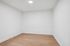 Bright, minimalistic room with elegant hardwood floors and pristine white walls, ready for your creative touch.