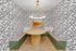 Chic dining nook with a round wooden table, stylish zigzag wallpaper, and ambient lighting, perfect for cozy gatherings.