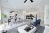 Contemporary open-plan living room with stylish dining area, modern kitchen, and elegant decor.