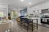 Modern open-concept apartment with sleek kitchen, inviting dining area, and stylish living space featuring elegant decor and natural light.