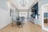 Elegant community clubhouse with modern decor, stylish geometric-patterned seating, and open space lighting.