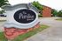 Welcome to The Pavilion Apartment Homes, offering charming brick architecture and lush surroundings.
