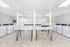 Bright and spacious laundry room with modern washing and drying machines, ideal for convenient and efficient living.