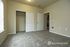 Inviting bedroom with plush carpet, ample closet space, and soft natural lighting creating a cozy atmosphere.