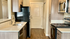 Chic modern kitchen with stainless steel appliances, sleek countertops, and elegant wood cabinetry offering a stylish culinary space.