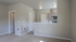 Modern apartment interior featuring a cozy open kitchen with stainless steel appliances and inviting neutral tones.