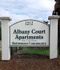 Inviting entrance sign for Albany Court Apartments, a serene retirement community for those aged 55 and older.