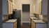 Modern kitchen with sleek stainless steel appliances, ample cabinetry, and elegant countertops, ideal for culinary enthusiasts.