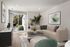 Inviting living room with a plush beige sectional sofa, contemporary decor, and a view of a beautiful garden through glass sliding doors.