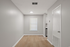 Bright, minimalist room with modern flooring, perfect for customization. Ideal for creating a personalized living or workspace.