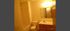 Inviting bathroom with modern fixtures, featuring a bathtub-shower combo, sleek vanity, and ambient lighting.