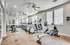 Spacious gym with state-of-the-art fitness equipment and large mirrors.