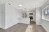 Bright and modern kitchen with sleek appliances, quartz countertops, and stylish pendant lighting, ideal for contemporary living.