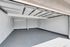 Spacious and pristine two-car garage with a sleek finish, perfect for storage and parking needs.