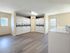 Bright and spacious laundry room featuring multiple washers and dryers with modern amenities for convenience.