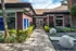 Clubhouse/Leasing Office entryway featuring tiled walk-up and stone garden