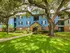 Exterior of light blue and brick building