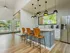 Clubhouse interior with breakfast bar and stainless steel refrigerator