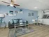 Living and dining area with couch, coffee table, dining table and chairs.