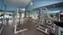 Community gym with weights and treadmills.