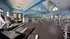 Community gym with treadmills and weights.