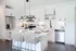 Kitchen with breakfast island, stainless appliances.