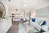 Kitchen with breakfast island, stainless appliances.
