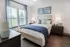 Bedroom with bed, dresser, nightstand.