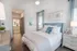 Bedroom with bed, dresser, nightstand.