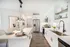 Kitchen with breakfast island, stainless appliances.