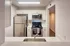 Kitchen looking through breakfast nook at appliances.