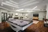 Community clubhouse with pool table, couches, and large mounted TV.