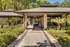 Leasing office entrance with palm trees surrounding it,