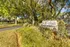 Community entrance with monument sign reading