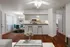 Living room overlooking kitchen with breakfast bar and dining room