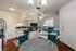 Living room overlooking kitchen with breakfast bar and dining room