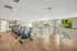 Community fitness center with various cardio and weight machines.