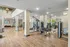 Community fitness center with various cardio and weight machines.