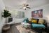 Dining and living room area.  Table and chairs, sofa and chair in background.