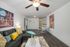 Living and dining area with wall mounted television and furnuture.