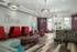 Community clubhouse with wood style flooring, modern furniture and lighting.