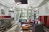 Community clubhouse with wood style flooring, modern furniture and lighting.