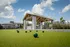 Bocce ball court with lanai in background