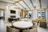 Clubhouse sitting area with couches, tv, fireplace, and chairs