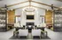 Clubhouse sitting area with couches, tv, fireplace, and chairs