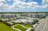 Aerial photo of Sorrento featuring buildings, clubhouse, and pool