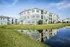 Apartment exterior with pond