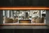 Clubhouse with modern furniture through fireplace